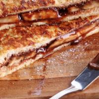Peanut Butter & Nutella (Stuffed French Toast) · Delicious French toast cooked to perfection and stuffed with Peanut butter & Nutella.