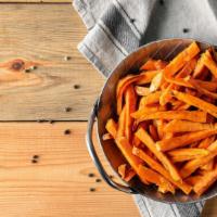 Sweet Potato Fries · Fresh sweet potatoes, cut into slices and salted and fried to perfection.