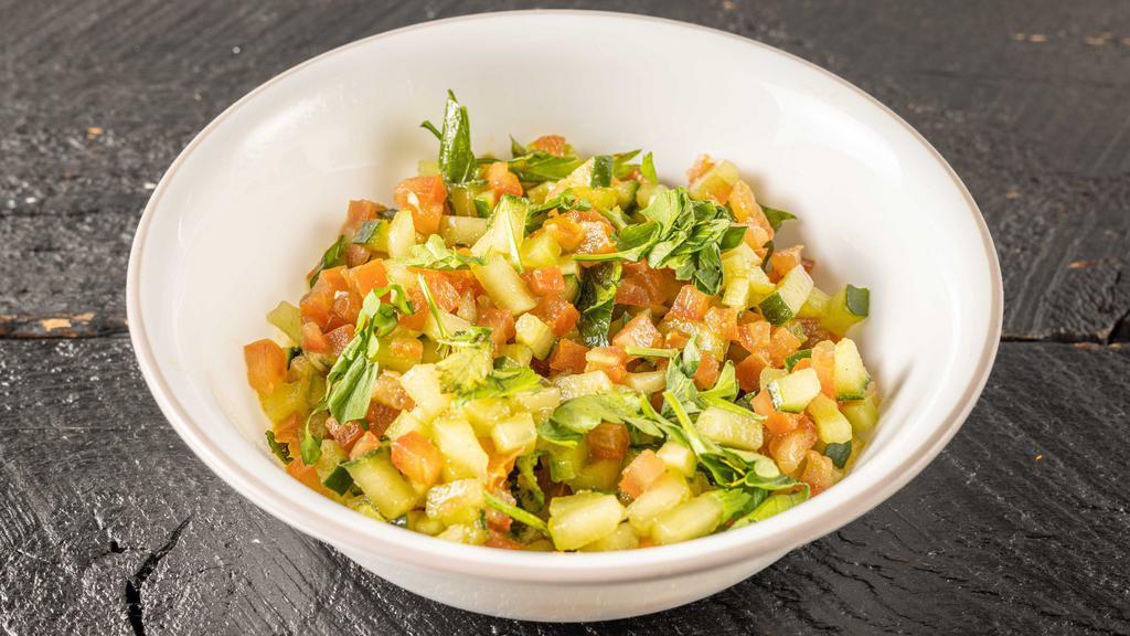 Kachumber Salad · Small. Sweet-tangy tomatoes, crunchy cucumbers and piquant onions go well with almost any Indian dish. Having some fresh, raw veggies with your meal or as a meal with tandoori chicken, cilantro chicken or plant-based burger without bun with additional price.