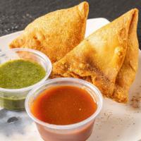Vegetable Samosa (2 Pieces) · Crispy pastries filled with potatoes, peas and spices. Served with chutney of your choice - ...