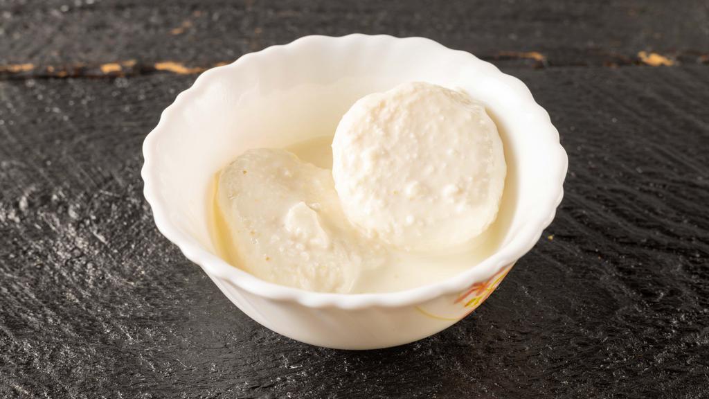 Rasmalai · Rasmalai is a creamy and milky syrup that consists of cottage cheese (chenna) balls. The syrup is purely made from milk, sugar and cream mixture.