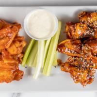 Wings By The Dozen · All wings served with celery sticks and blue cheese dressing.