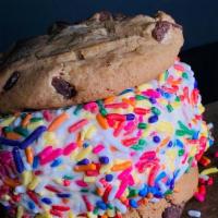 Vanilla Cookie Sandwich · Two of our chocolate chip cookies with a scoop of vanilla ice cream and a rainbow sprinkles ...