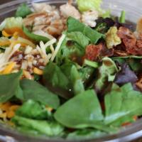 Fresh Spinach Salad · Freshly prepared salad topped with Spinach, Bacon bits, mushrooms, red onions, and mixed gre...