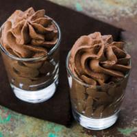 Chocolate Mousse · Smooth & Shiny melted chocolate dessert topped with whipped cream.