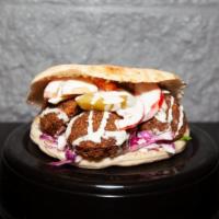 Falafel Sandwich · Fried patty with chickpeas, onions, and garlic. Add hummus for an additional charge.
