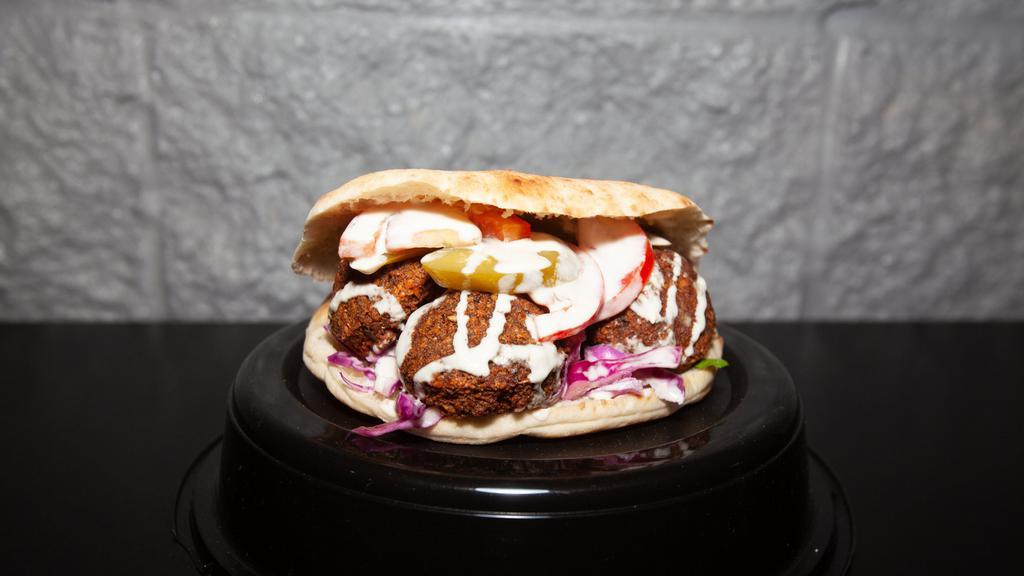 Falafel Sandwich · Fried patty with chickpeas, onions, and garlic. Add hummus for an additional charge.