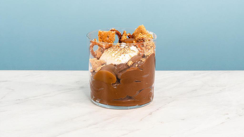 S'Mores Pud · Decadent chocolate pudding topped with salty brown butter grahams, toasted nougat, caramel and a smooth honey-chocolate drizzle | Allergens: Gluten, Milk, Egg