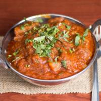 Lamb Vindaloo · Original Goa curry of onions, tomatoes, potatoes & spices.