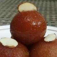 Gulab Jamun · S milk dough balls dipped in sugar, nuts, and raisins.