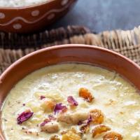 Kheer · Rice pudding, garnished with almonds and syrup.