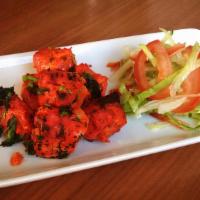 Chicken Tikka Dry · Andoori oven cooked boneless chicken breast with onion and bellpeper.