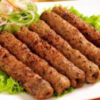 Chicken Seekh Kabab · Sliced chicken marinated in herbs and spices. Cooked in a clay oven.