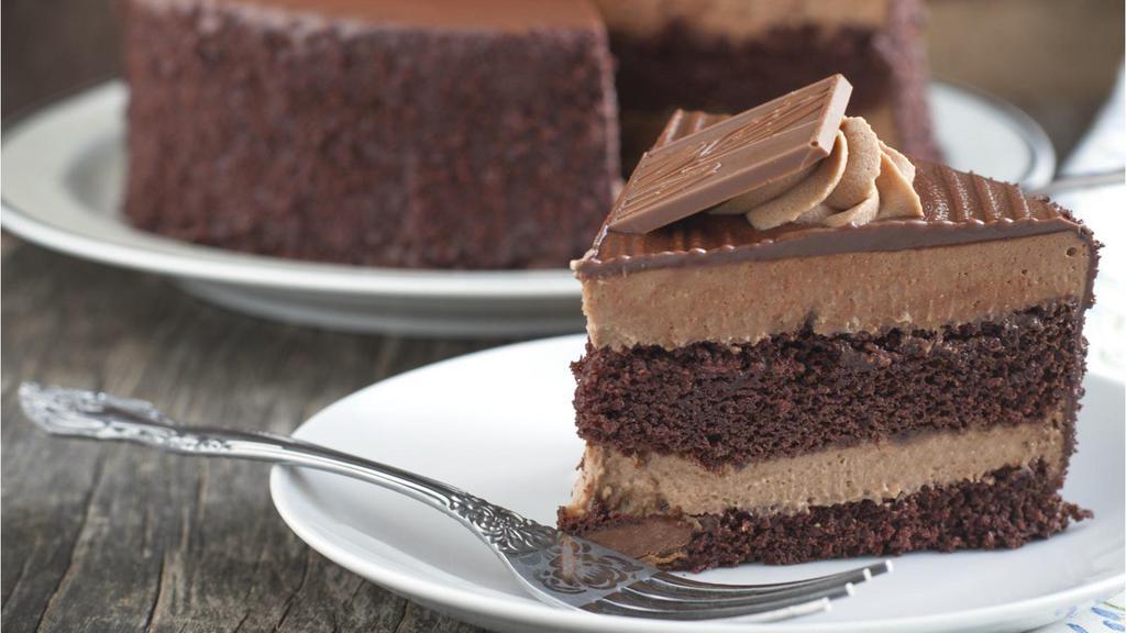 Chocolate Mousse Cake · Fresh baked chocolate layer cake filled and topped with chocolate mousse.