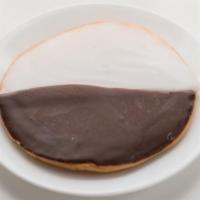 Jumbo Black & White Chip Cookie · Fresh baked large cookie dipped in white chocolate and milk chocolate.