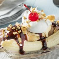 Banana Split · Haagen dazs vanilla and chocolate ice cream between ripe bananas and topped with fresh whipp...