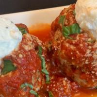 Meatballs (2) · Two large meatballs; Oven roasted in marinara with a dollop of ricotta cheese.