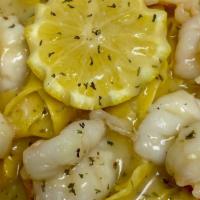 Shrimp Scampi · served over pasta