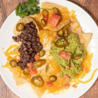 Guacamole Nachos · Always covered with cheese. chips covered with cheese jalapenos black beans and tomato.