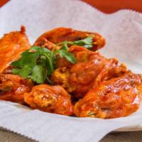 Buffalo Wings  · With bleu cheese and celery.