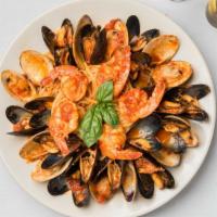 Seafood Linguini · Served with mussels, clams and shrimp with a choice of red sauce or garlic and oil.