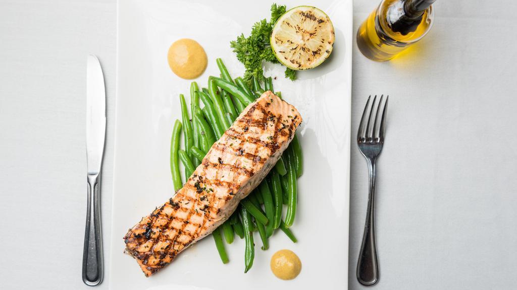Grilled Salmon Dijon · Surrounded by dijon mustard, wine and lemon reduction, vegetables pasta in red sauce or garlic and oil.