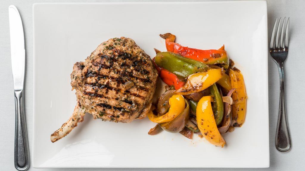 Grilled Pork Chop · Onions and peppers sauteed over the same sauce, vegetables pasta in red sauce or garlic and oil.