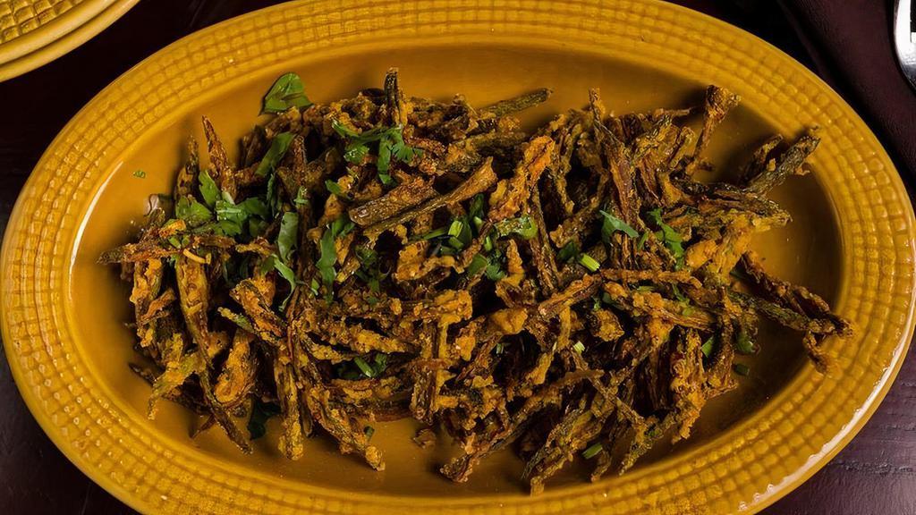 Kurkuri Bhindi · Okra tossed with onions, lime and chaat masala.