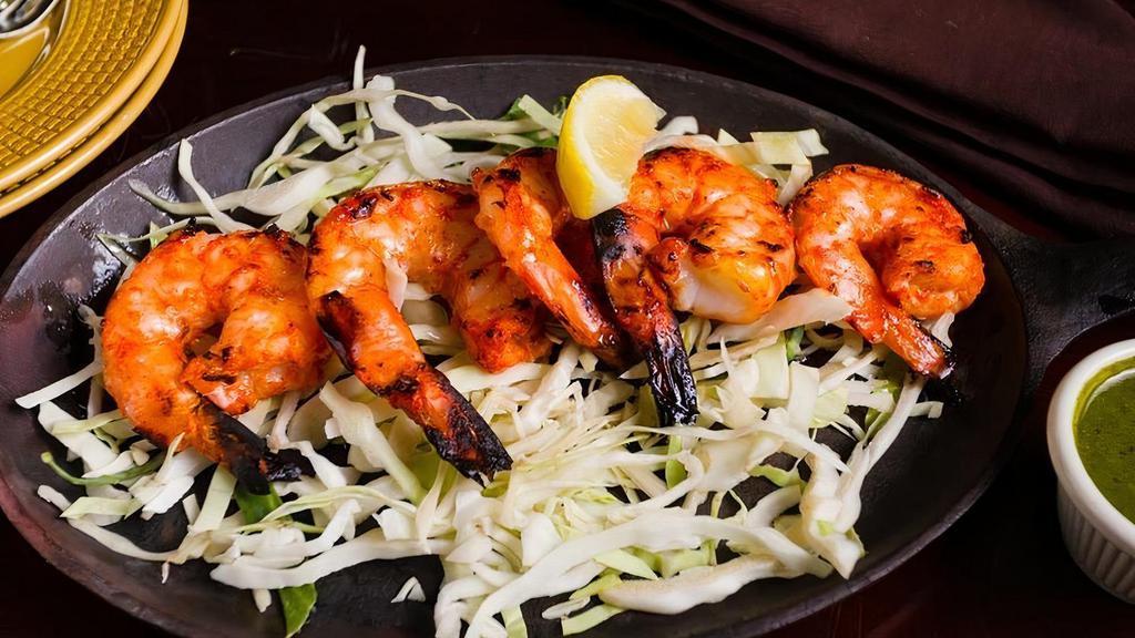 Tandoori Shrimp · Skewered shrimp in tandoori spices.