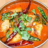 Allepy Red Curry · Fish cooked with kokum, tomatoes and whole garlic.