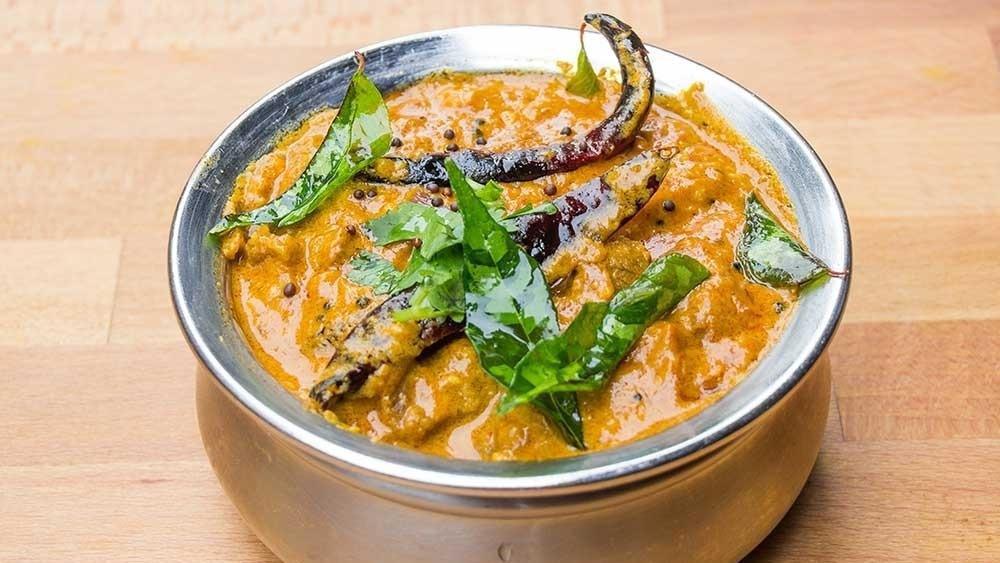 Lamb Madras · Lamb with Coconut, Dry Red Chilies and Curry Leaves. Spicy.