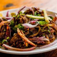 Lamb Pepper Fry · Lamb Tossed with Peppercorns and Fresh Coconut. Spicy.