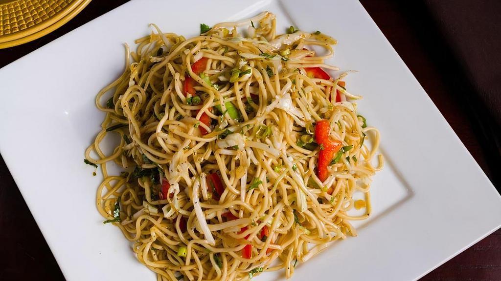 Vegetable Hakka Noodles · Noodles tossed with vegetables and soy sauce.