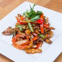 Chili Chicken (Dry) · Chicken tossed with green chilies, bell peppers, onions, and soy sauce.