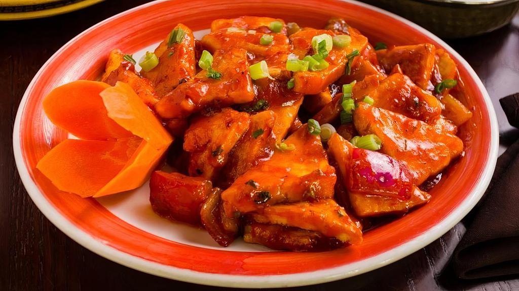 Chili Paneer (Dry) · Paneer cheese tossed with scallions, green chilies, bell peppers, onions,  and soy ginger gravy.