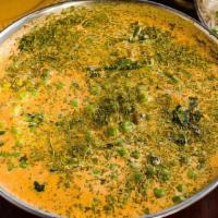 Mutter Paneer · Green peas and cheese in creamy tomato sauce.