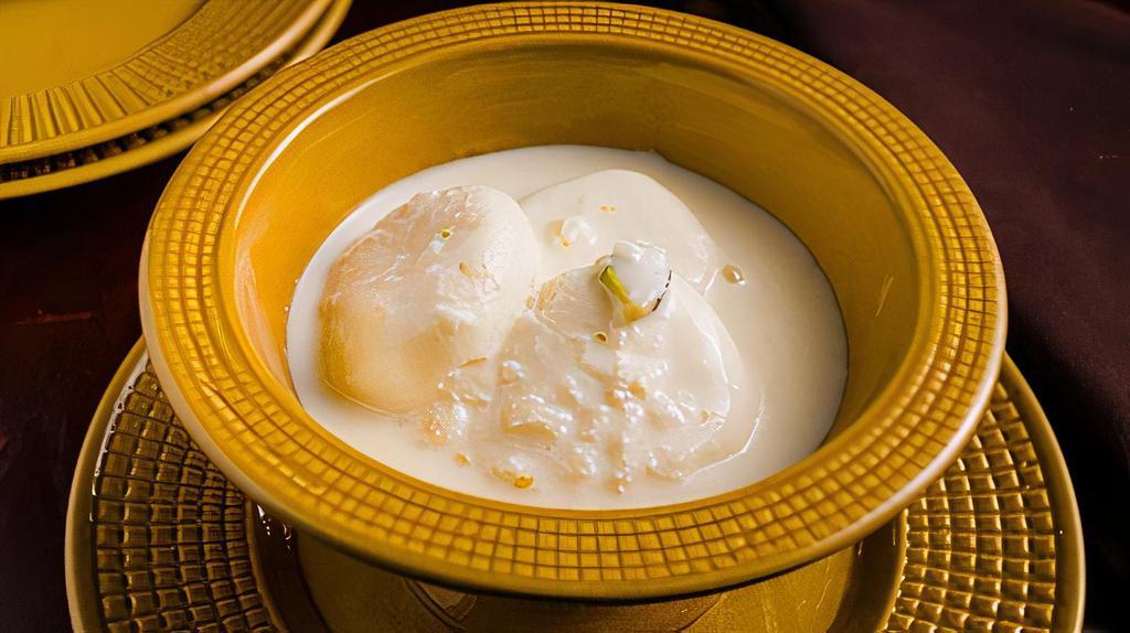 Rasmalai · Cheese balls in reduced sweet milk and pistachios