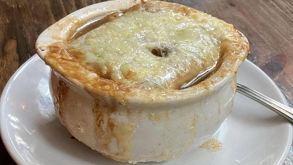 French Onion · Classic French Onion soup, topped with bread and melted cheese.