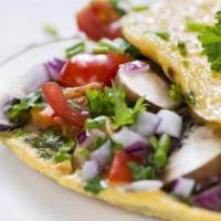 Veggie Omelette · Delicious mixed veggies and cheese.