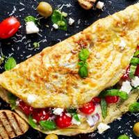 Greek Omelette · Delicious feta cheese, onions, and tomatoes.