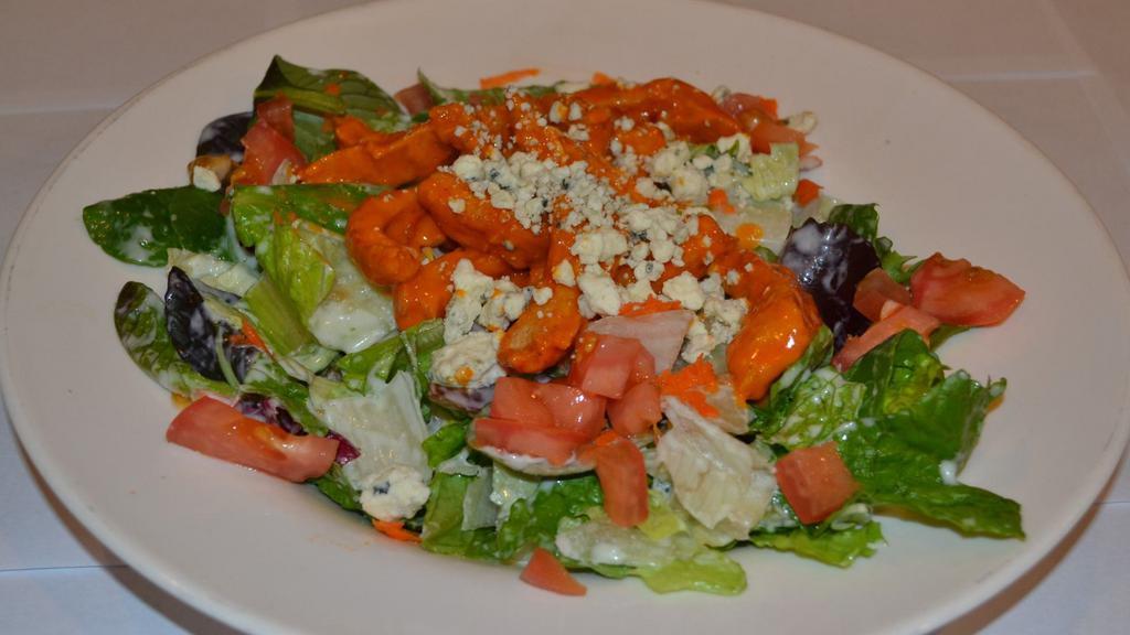 Buffalo Chicken Salad · Fresh mixed greens tossed in ranch dressing, topped with buffalo chicken strips, tomatoes, and crumbled blue cheese.