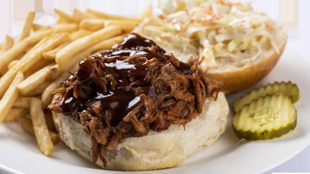 Pulled Pork Sandwich · NEW-pulled pork cooked with BBQ sauce, served with cole slaw on a brioche bread