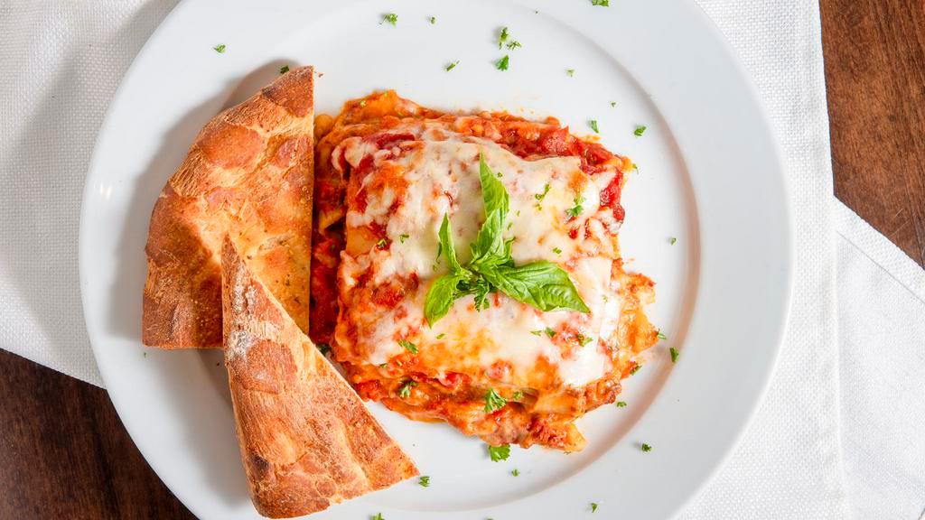 Lasagna · Layers of pasta, ground beef, ricotta and mozzarella cheese with tomato sauce.