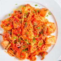 Calamari Marinara Over Spaghetti · Homemade marinara, garlic, basil and white wine.