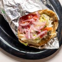 Gyro · Strips of gyro meat with a homemade tzatziki sauce, lettuce, tomatoes, and onions wrapped in...