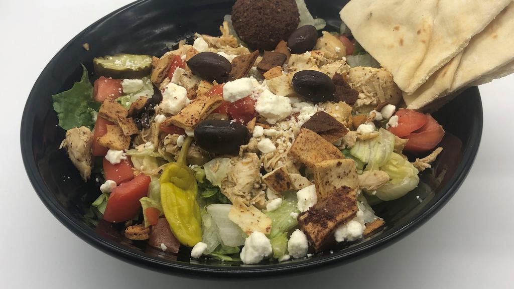 Greek Chicken Salad · Lettuce topped with chicken, tomatoes, feta cheese and kalamata olives, pita croutons served with our homemade Greek salad dressing.