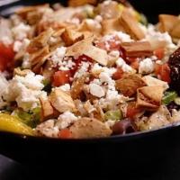 Greek Salad · Vegetarian. Lettuce, tomatoes, feta cheese and kalamata olives, pita croutons served with ou...