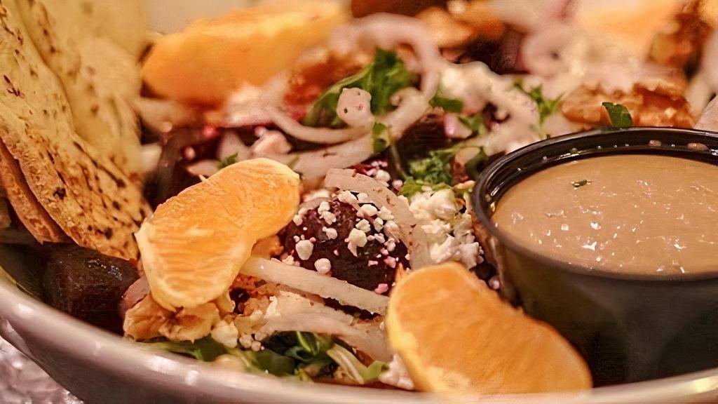 Beet Salad · Vegetarian. Roasted beets over arugula with oranges, onions, feta cheese, walnuts. Served with homemade balsamic dressing, falafel patty. Add chicken for additional price.