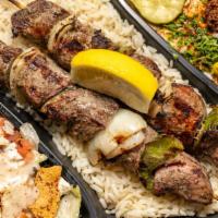 Shish Kabob Hs · Any two skewers of tender char-broiled lamb, chicken, shrimp, or kafta kabob served on a bed...