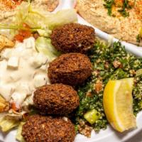 Vegetarian Plate · Vegan, vegetarian. Hummus, baba ganoush, tabbouleh, falafel patties, house salad, and pita.